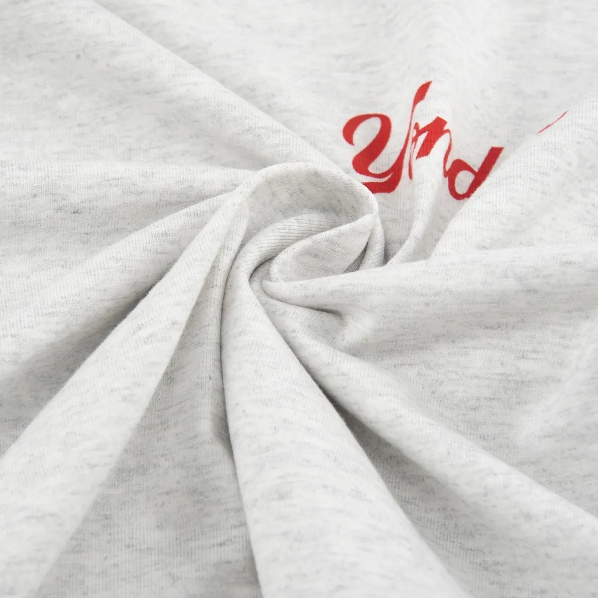 Close-up of light heather gray cotton T-shirt fabric