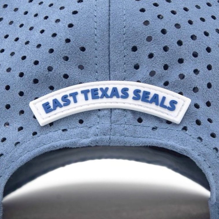 Woven patch on the back of a blue cap
