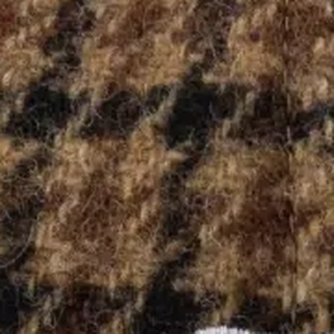 Close-up of brown houndstooth wool fabric