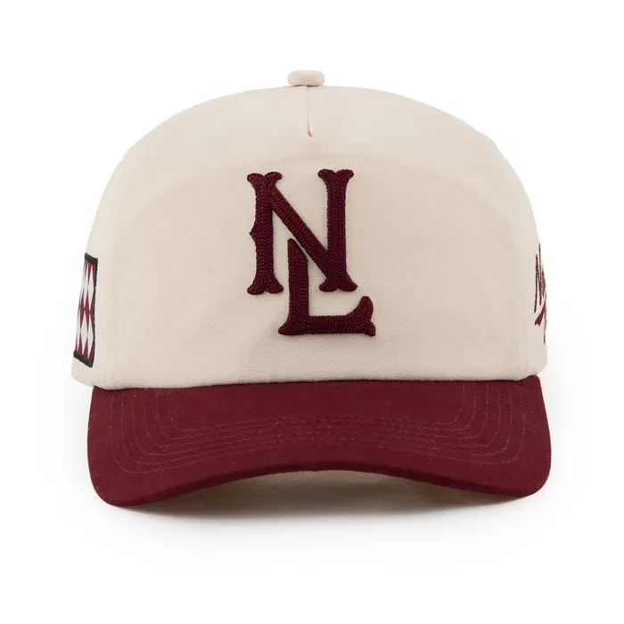 Five-panel hat, cream crown with maroon brim, maroon chenille-style monogram, script side embroidery, woven diamond label on the side