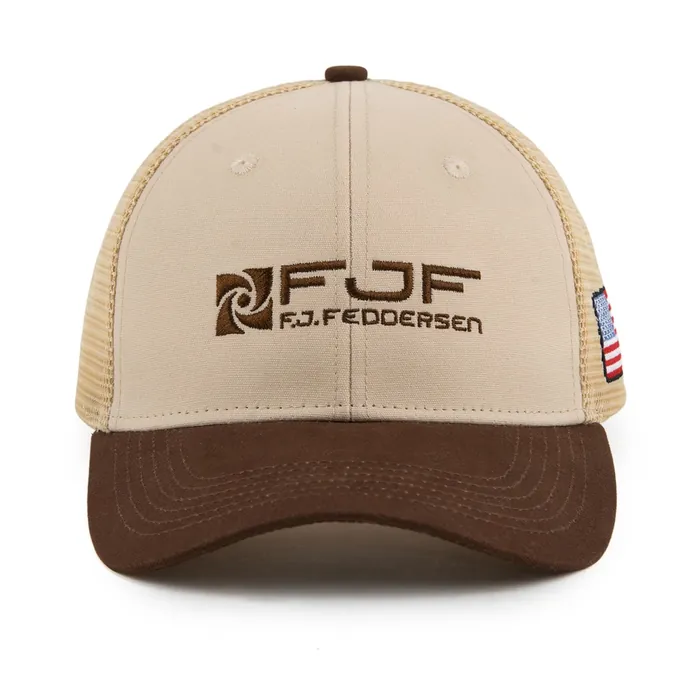 Mesh-back trucker, cream front with brown brim, brown embroidered logo, American flag patch on the side, flag-print underbrim