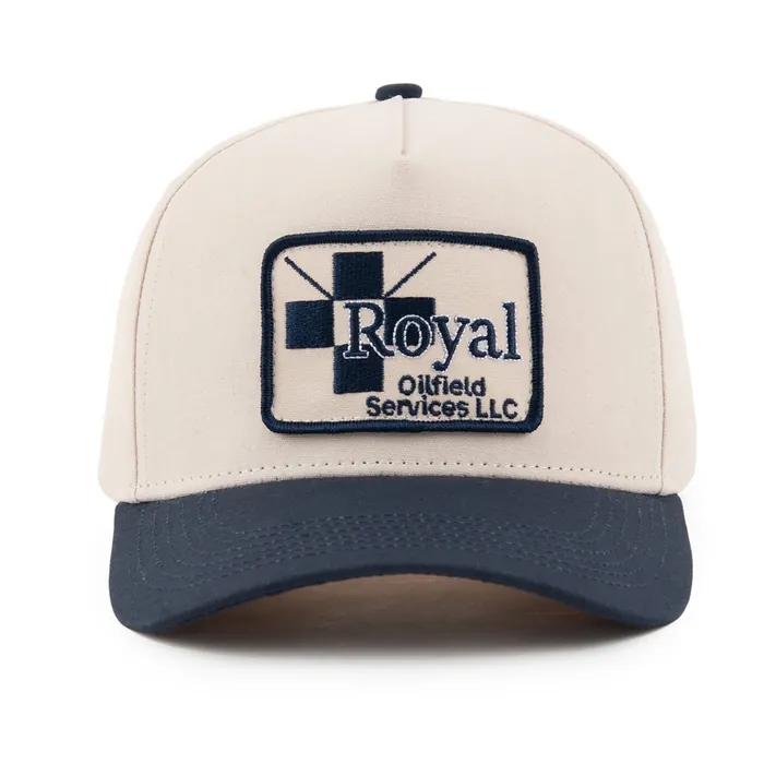 Five-panel hat, cream crown with navy brim, rectangular woven patch