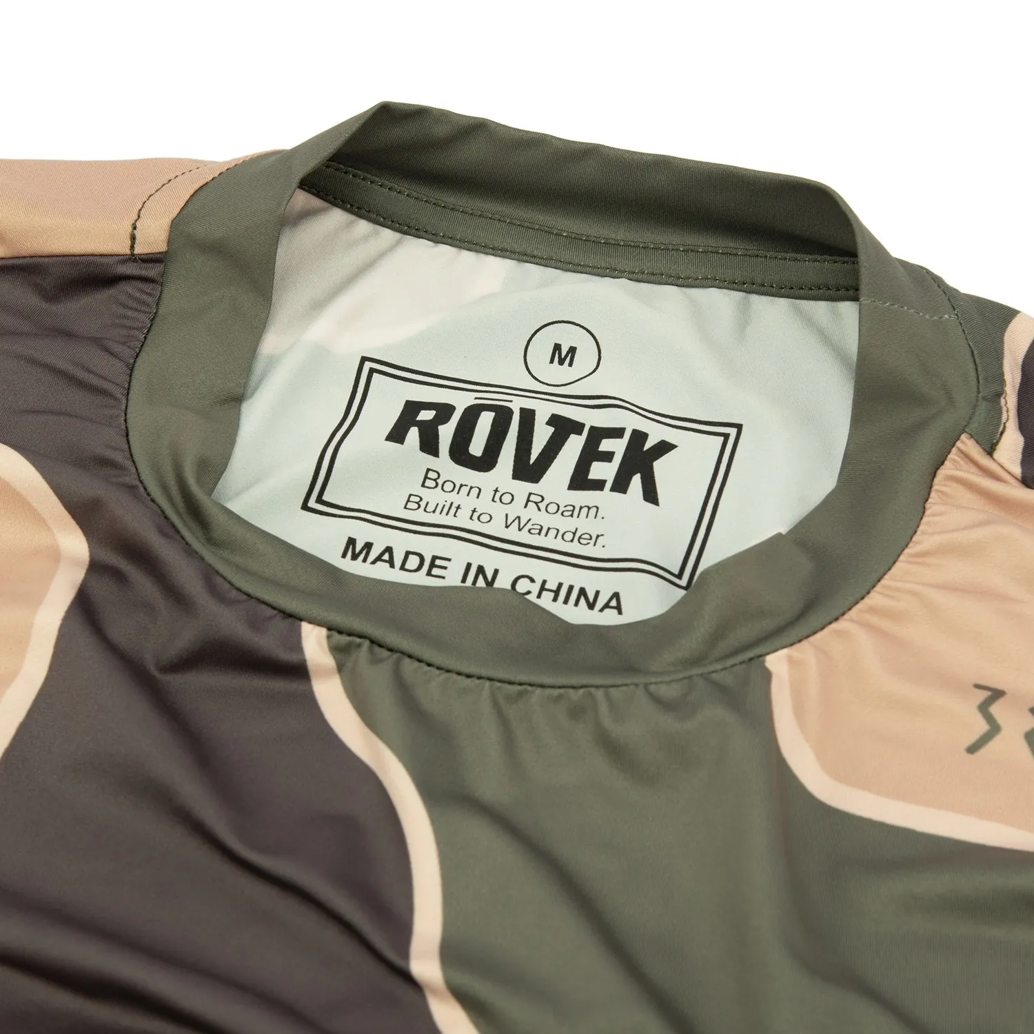 Printed neck label inside the collar of a camo print tee