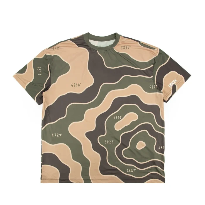 All-over printed performance tee in green, tan and brown topographic pattern, small white print near the hem, printed neck label