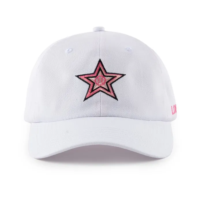Six-panel unstructured cap in white, pink and black star embroidery, pink side lettering, brass buckle strap