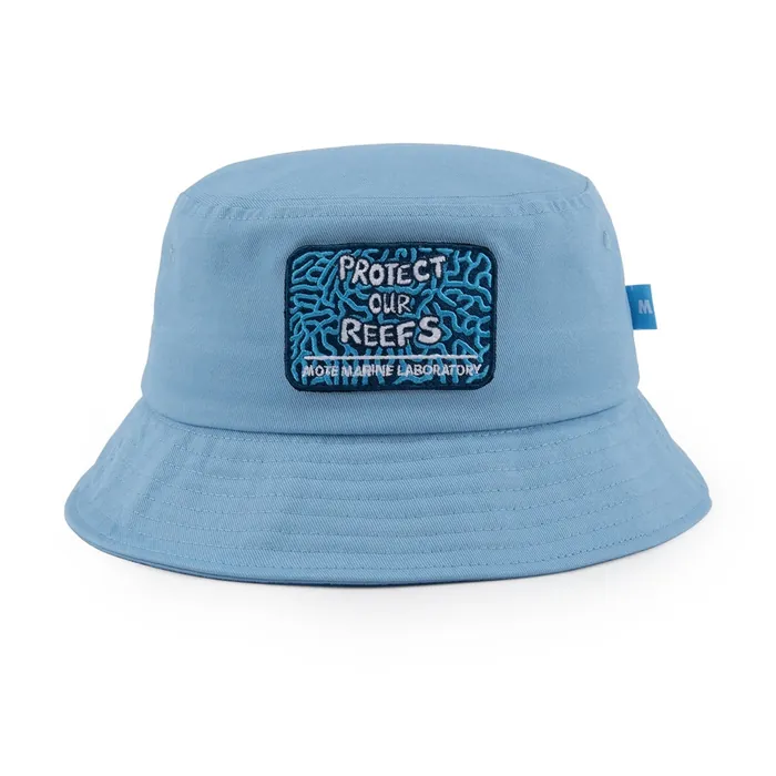 Light-blue bucket hat with white drawcord and toggle, rectangular woven patch on the front, branded interior label